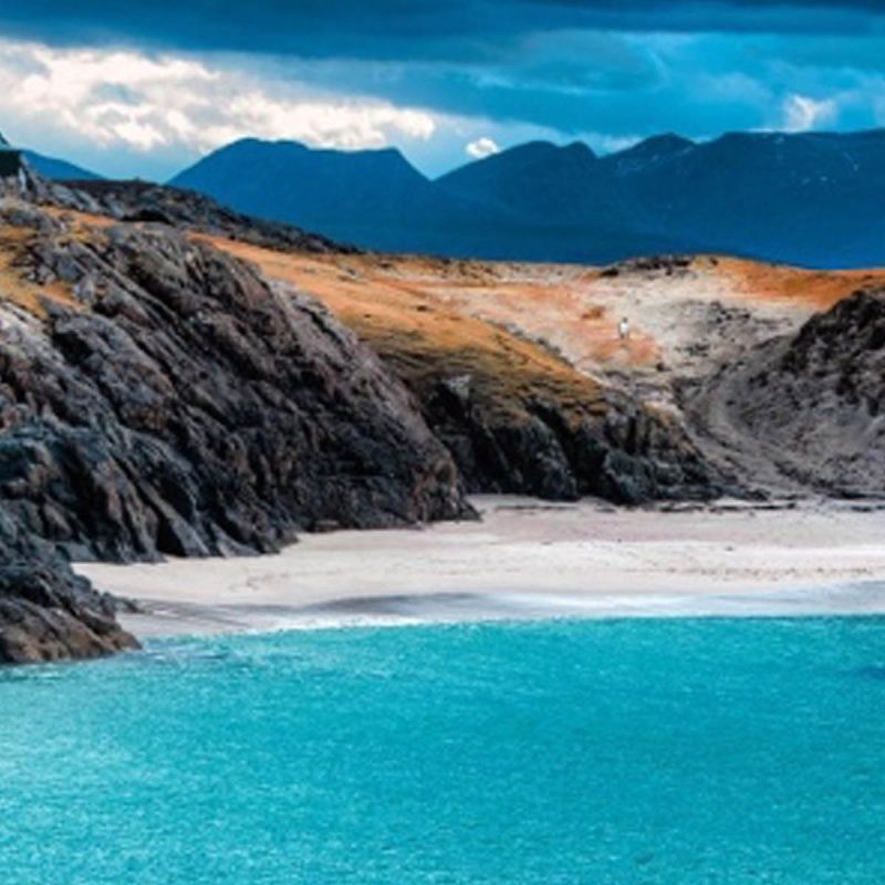 Clachtoll Beach with white sands and crisp blue sea in the North Coast 500 in Scotland