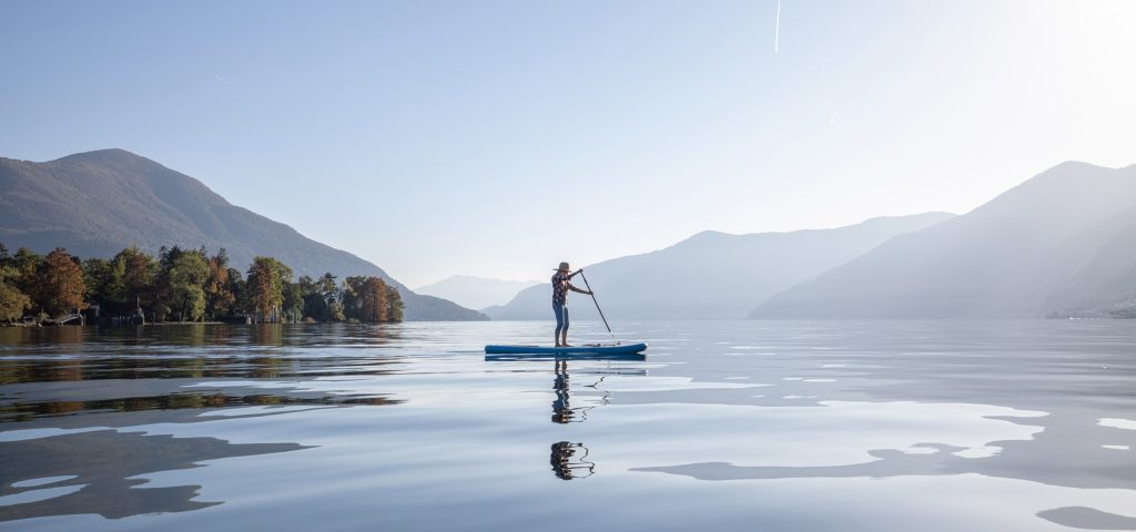 A woman paddle boarding