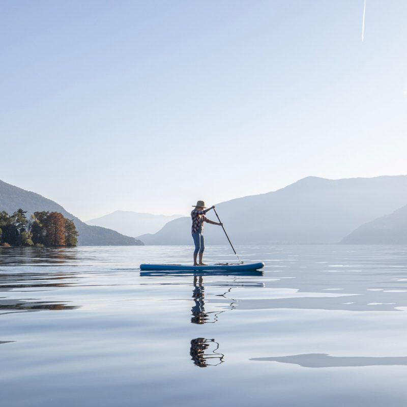 A woman paddle boarding