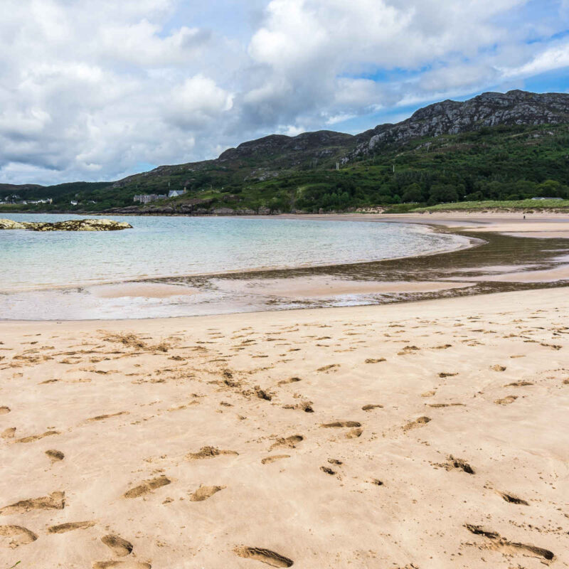 Footspints in the sand at Gairloch Beach in Scotland