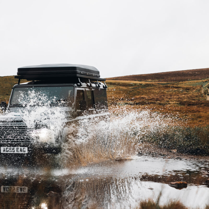 Landrover driving through water in Scottish Highlands